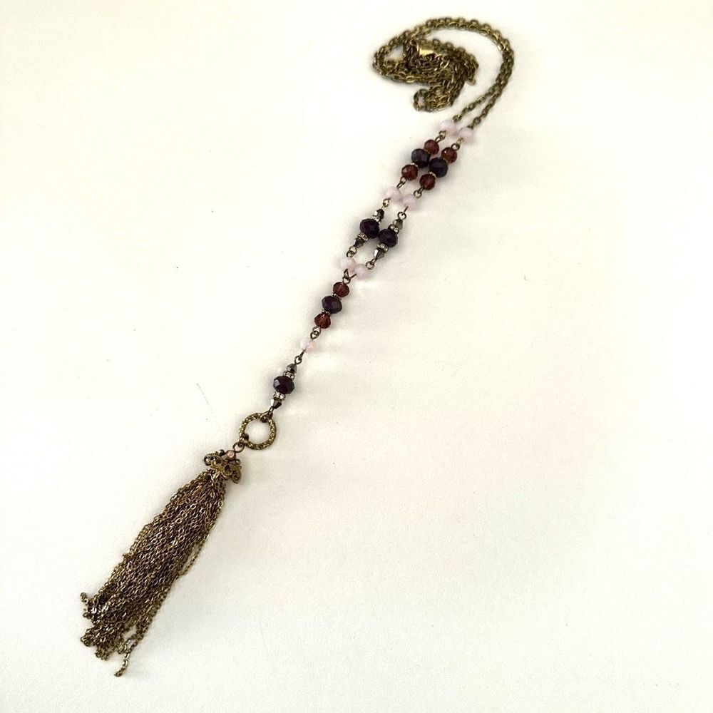 Purple beaded long gold tone tassel necklace